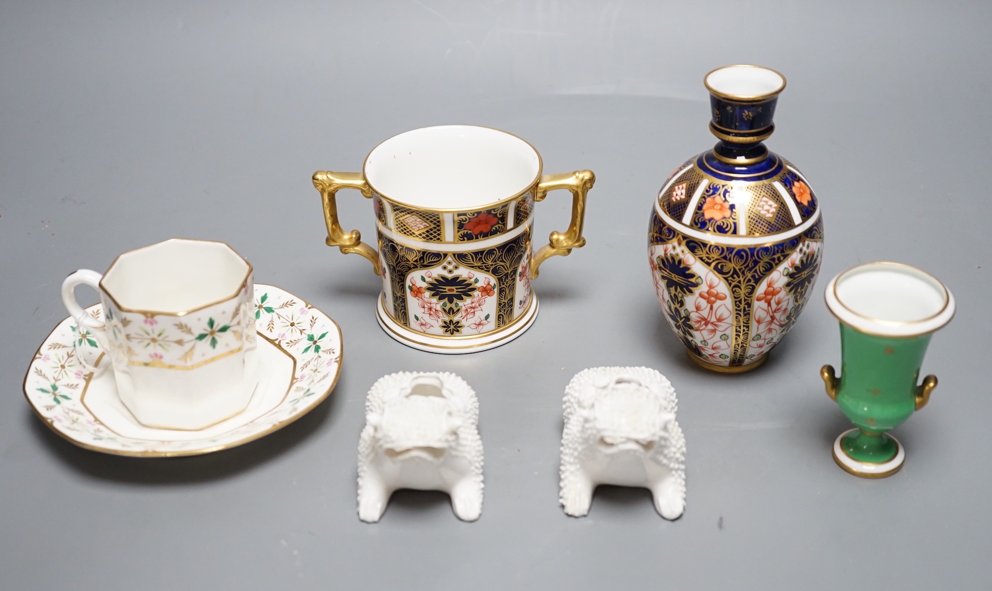 A Royal Crown Derby vase of baluster shape painted with pattern 1128, a two handled loving cup, with 1128, an RCD campana vase with green ground painted with flowers, two Derby King Street toads and a King Street octagon